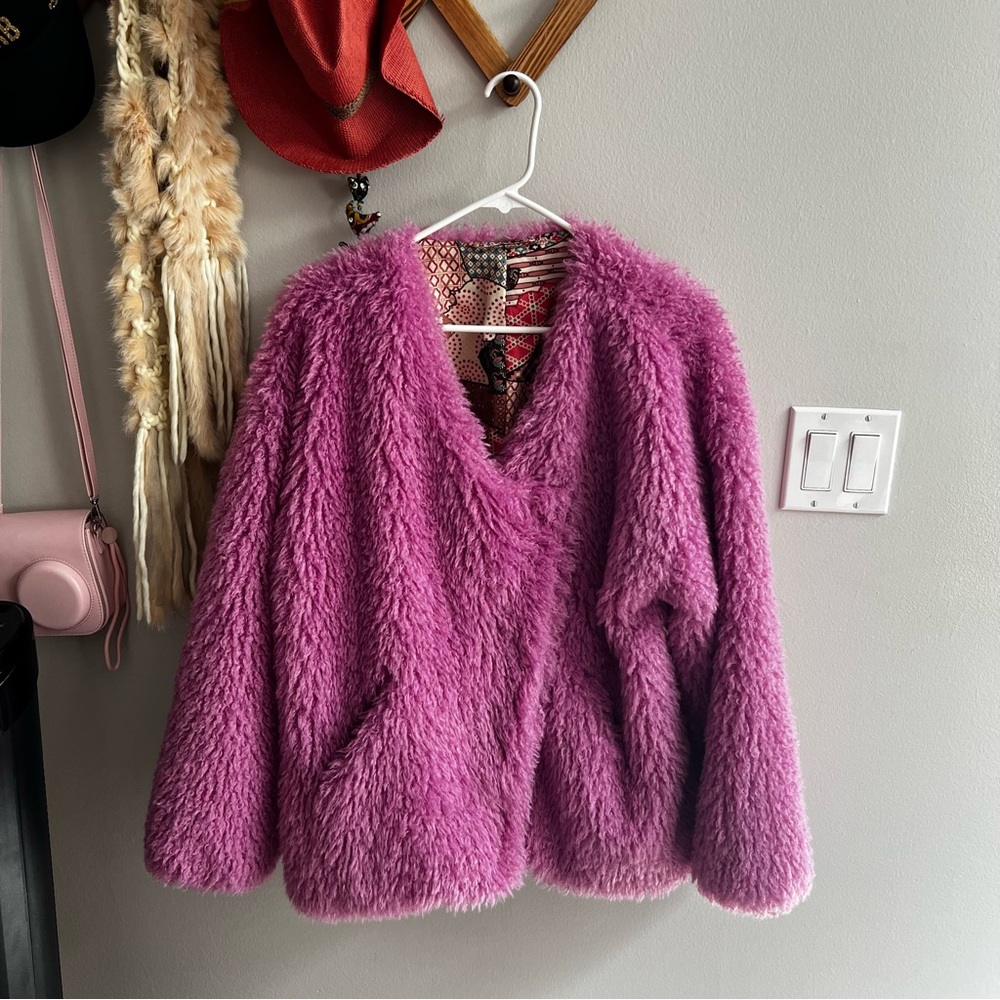 Pink “fur” jacket. Size small but fits like a large.